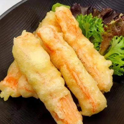 Crab Meat Tempura — Crabstick and fresh vegetables dipped in a light tempura batter and deep-fried.