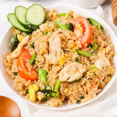 Khao Pad (Thai Fried Rice) — Thai fried rice with sweet onion, tomatoes, egg and green onion.
