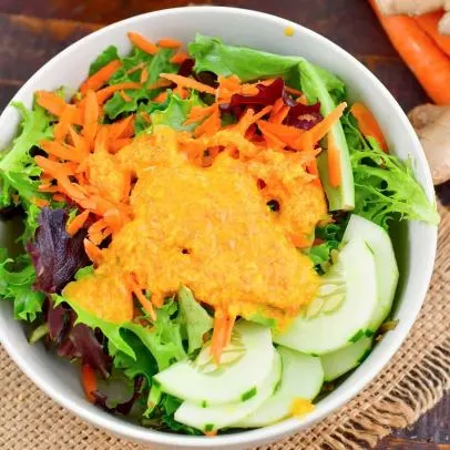 Ginger Salad — Fresh green salad with tomatoes, cucumbers and carrots with ginger dressing.