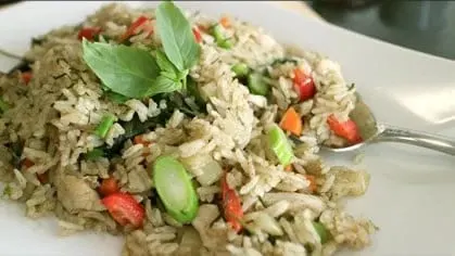 Khao Pad Gang Kiew Wan (Green curry fried rice) — Fried rice with green curry sauce, eggplant, bamboo shoots, green beans, zucchini, red chili and basil leaves.