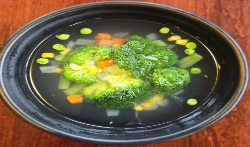 Mix Vegetable Soup — Mixed vegetables (corn, carrots, green beans, broccoli, onions, and celery) in a clear vegetable broth.