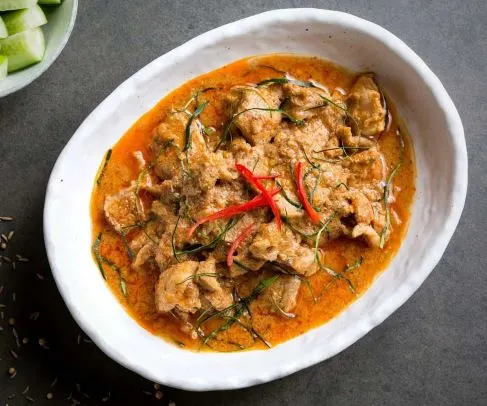 Panang Curry — Panang curry paste and coconut milk simmered to a thick curry sauce, finished with aromatic kaffir lime leaves.