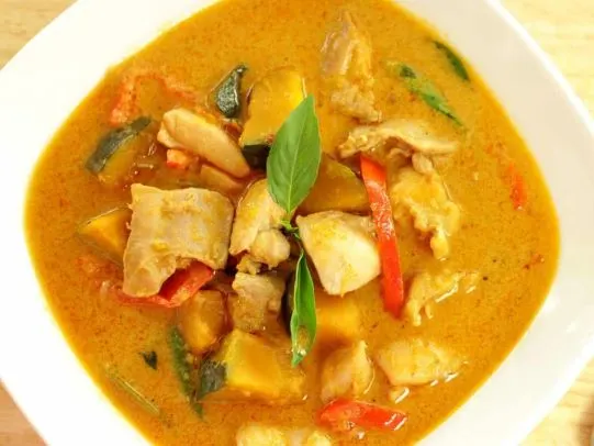 Khao Phed (Thai Red Curry) — Red curry paste, coconut milk, Thai eggplant, bamboo shoots and fresh basil leaves.