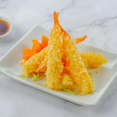 Shrimp Tempura (Appetizer) — Shrimp and fresh vegetables dipped in a light tempura batter and deep-fried.