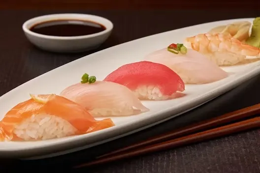 Sushi Sampler (Appetizer) — Chef's choice assortment of nigiri sushi. (5 pieces)