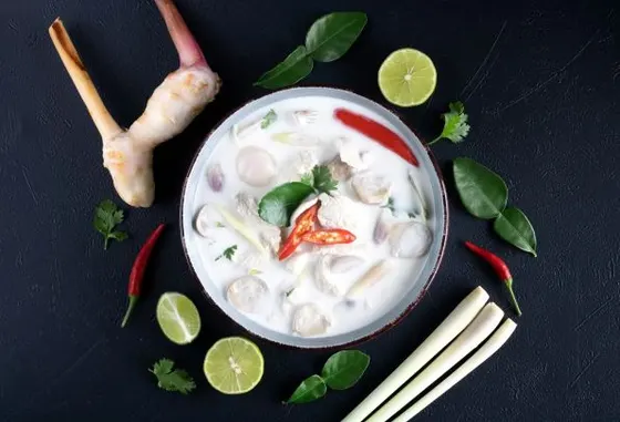Tom Kha Gai (Chicken Coconut Soup) — Silky coconut and galangal soup with chicken and mushrooms.