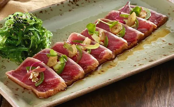 Tuna Tataki — Sliced seared tuna and served with ponzu sauce.